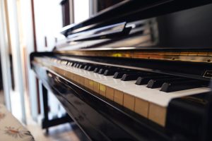 Photo of quality piano at a side angle from piano keys